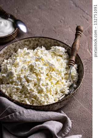 Cottage cheese on light background Cottage cheese on light background 132751091