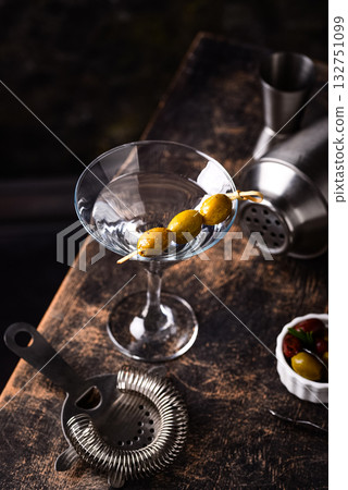 Traditional martini cocktail with olives and Traditional martini cocktail with olives and 132751099