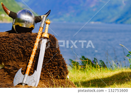 Viking helmet on fjord shore, Norway Viking helmet on fjord shore, Norway 132751600