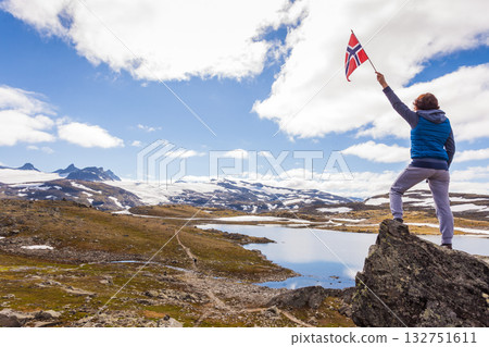 Tourist with norwegian flag in mountains Tourist with norwegian flag in mountains 132751611