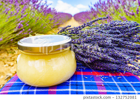 Jar with honey and lavender flowers. Jar with honey and lavender flowers. 132752081
