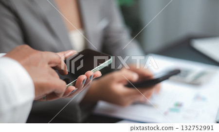 Business Team Using Smartphone for Communication and Data Sharing Business Team Using Smartphone for Communication and Data Sharing 132752991