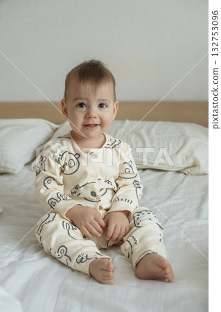 Joyful baby in bear print pajamas 132753096