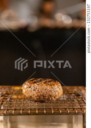 Grilled Hamburg, a patty of ground beef, on the grill Grilled Hamburg, a patty of ground beef, on the grill 132753197