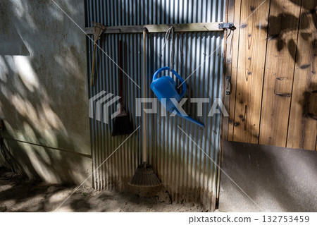 Cleaning tools hanging on the wall Cleaning tools hanging on the wall 132753459