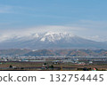 Snow-capped Tokachi mountain range and rural scenery of Furano 132754445