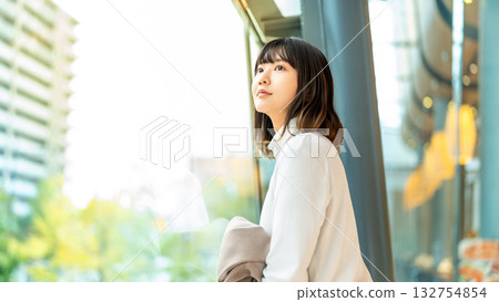 Woman looking out the window 132754854