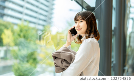 Young woman making a call on her smartphone 132754856