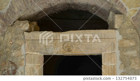 Cross on the ancient wall of the Church of St. Nicholas in Demre, Myra, Antalya Province 132754873
