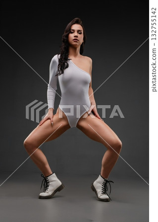 Sensual woman poses in elegant lingerie with striking footwear Sensual woman poses in elegant lingerie with striking footwear 132755142