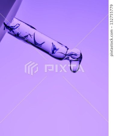 A pipette with serum demonstrating its juicy texture on a purple background. 132755779