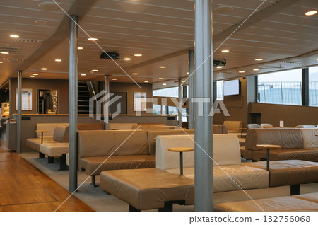 Modern ferry interior with brown leather seating and minimalist design aesthetic Modern ferry interior with brown leather seating and minimalist design aesthetic 132756068