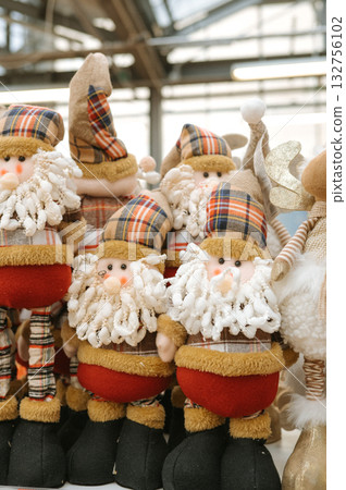 Festive holiday gnome decorations with plaid hats and beards 132756102
