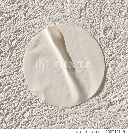 Round white sticker on textured white surface with shadow effect Round white sticker on textured white surface with shadow effect 132756149