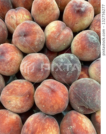 Peaches in a close-up view showcasing fresh fruit texture and color 132756277