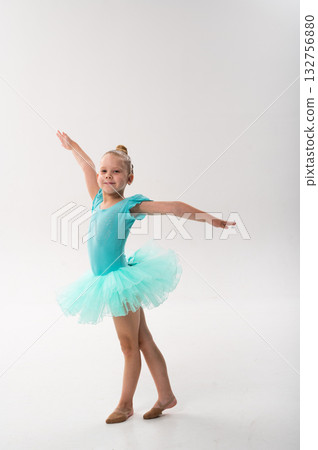 Girl ballerina with hearing implant raising arms gracefully. Expression of equality, empowerment, and sound restoration through classical dance and technology. 132756880