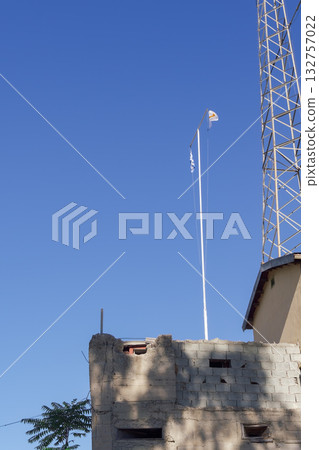 Greek and Cypriot flags on poles above a divided building in Cyprus Green Zone. 132757022