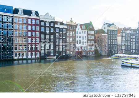 Amsterdam city colorful houses and canal water. Street architecture Amsterdam city colorful houses and canal water. Street architecture 132757043