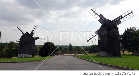 Kyiv, Ukraine, September 1, 2025: Ancient mills in the open-air museum of folk architecture and everyday life of Ukraine 132757172