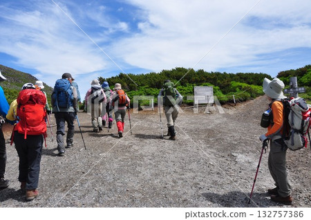 Hokkaido Daisetsuzan traverse Climbers heading to the summit of Mt. Kurodake at the Kurodake fork Hokkaido Daisetsuzan traverse Climbers heading to the summit of Mt. Kurodake at the Kurodake fork 132757386