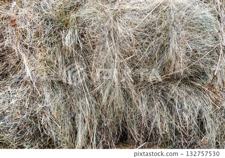 Hay as a natural background. Dry grass as a creative background texture. Hay as a natural background. Dry grass as a creative background texture. 132757530