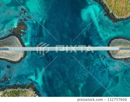 Aerial view of bridge, sea with waves and stones at sunset Aerial view of bridge, sea with waves and stones at sunset 132757608