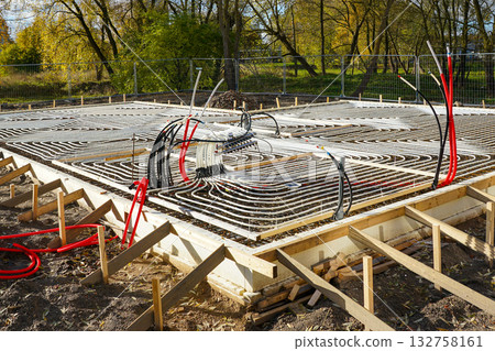 Underfloor heating system installation in concrete foundation construction site 132758161