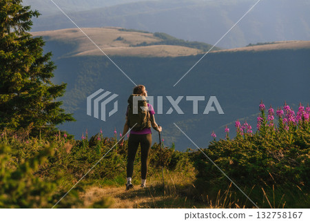 Woman with Tourist Backpack Hiking in Mountains Woman with Tourist Backpack Hiking in Mountains 132758167