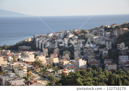 Greece East Macedonia Kavala city illuminated by the setting sun 132758278