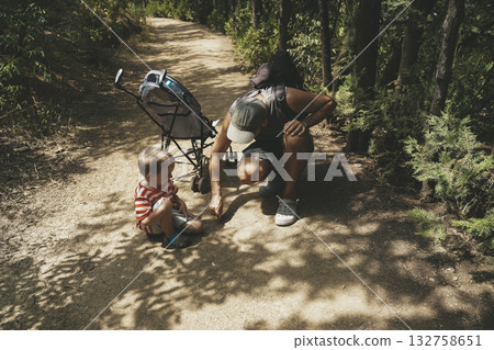 Father and Toddler Spending Time in Summer Forest Father and Toddler Spending Time in Summer Forest 132758651