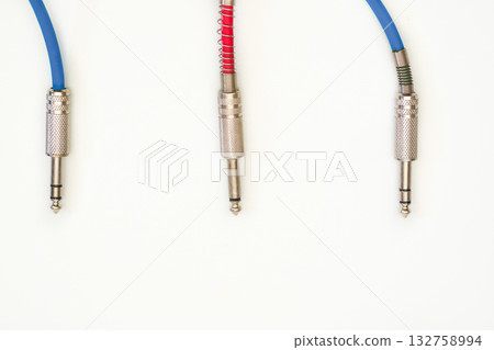 Blue red cables with metalic jacks.Connection electric guitar,sound equipment Blue red cables with metalic jacks.Connection electric guitar,sound equipment 132758994