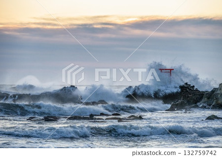 A torii gate towering over the stormy Pacific Ocean A torii gate towering over the stormy Pacific Ocean 132759742