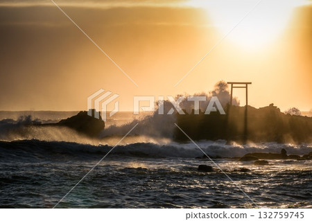 A torii gate towering over the stormy Pacific Ocean 132759745