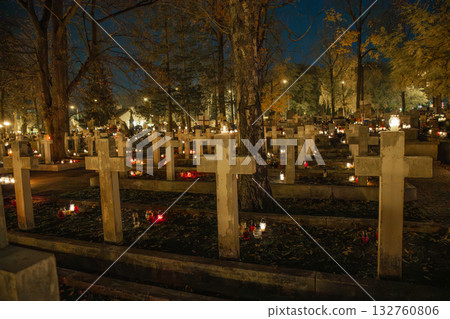 Cemetery with crosses and candles at night All Saints Day background in Poland Cemetery with crosses and candles at night All Saints Day background in Poland 132760806