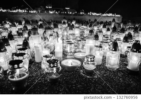 All Saints Day candles and lanterns at cemetery memorial, night background in Poland 132760956