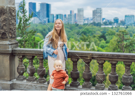 Mother with her young son near Chapultepec Castle in Mexico City, enjoying a cultural family trip. Parenthood, love, heritage sightseeing, and family bonding travel concept 132761066