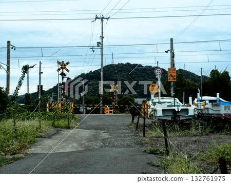 Rural railroad crossing with a boat Rural railroad crossing with a boat 132761975