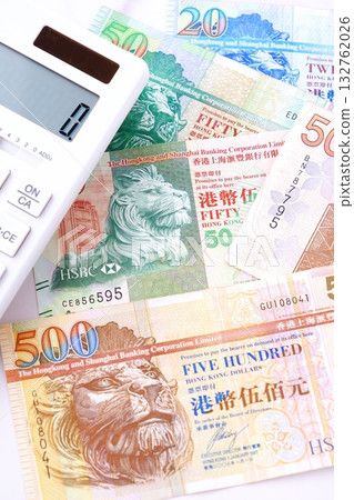 Hong Kong currency, Hong Kong dollar (HKD) banknotes and calculator Hong Kong currency, Hong Kong dollar (HKD) banknotes and calculator 132762026