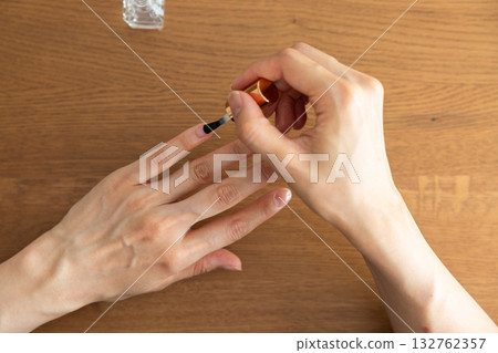 Woman's hands doing nail care 132762357