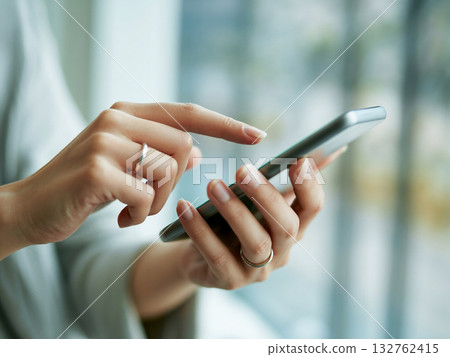 Woman's hand operating a smartphone Generative AI Woman's hand operating a smartphone Generative AI 132762415