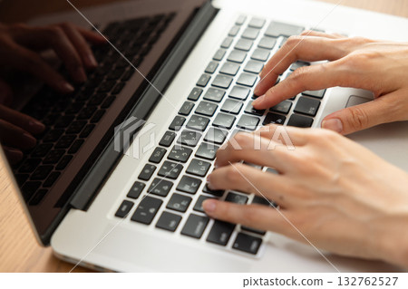 Women handling personal computers 132762527