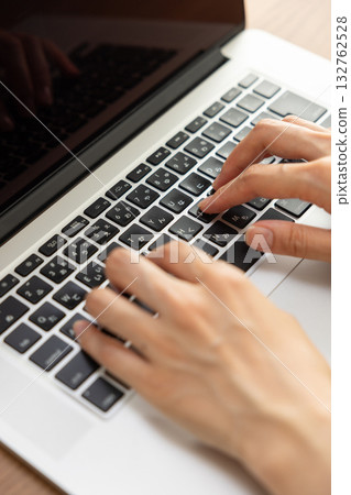 Women handling personal computers 132762528