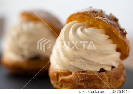 Cream puffs filled with plenty of fresh cream 132763044