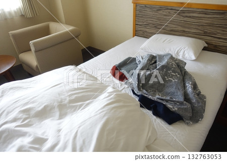 Messy hotel bed at checkout Messy hotel bed at checkout 132763053