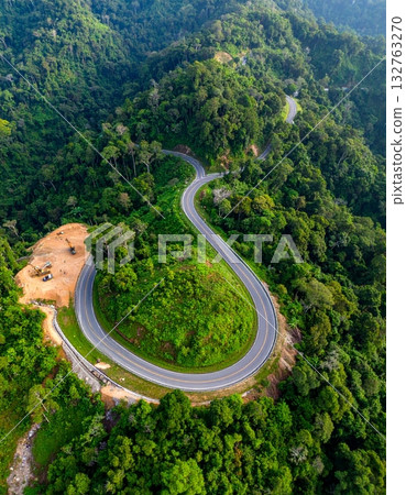 Road in the middle of the forest construction up to the mountain Road in the middle of the forest construction up to the mountain 132763270