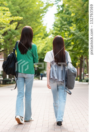 Female college student walking on university campus Female college student walking on university campus 132763569