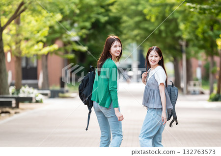Female college student walking on university campus 132763573