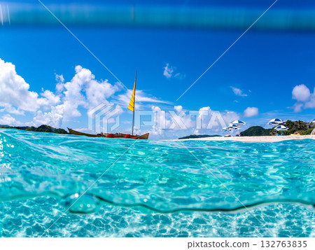 Partially submerged shot of Okinawa's Sabani and white sand beach. Beautiful coral reefs and schools of tropical fish. Kabi Island, Kerama Islands, Shimajiri District, Okinawa Prefecture Partially submerged shot of Okinawa's Sabani and white sand beach. Beautiful coral reefs and schools of tropical fish. Kabi Island, Kerama Islands, Shimajiri District, Okinawa Prefecture 132763835