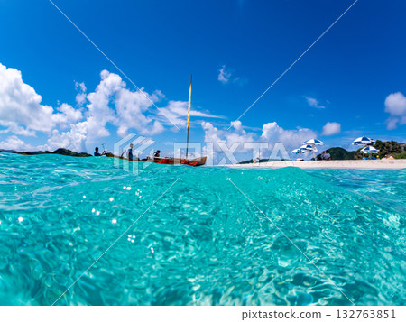 Partially submerged shot of Okinawa's Sabani and white sand beach. Beautiful coral reefs and schools of tropical fish. Kabi Island, Kerama Islands, Shimajiri District, Okinawa Prefecture Partially submerged shot of Okinawa's Sabani and white sand beach. Beautiful coral reefs and schools of tropical fish. Kabi Island, Kerama Islands, Shimajiri District, Okinawa Prefecture 132763851