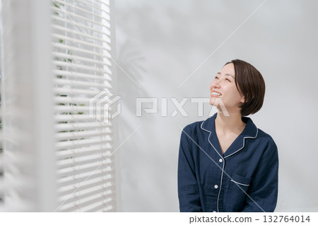 Woman relaxing in pajamas Woman relaxing in pajamas 132764014